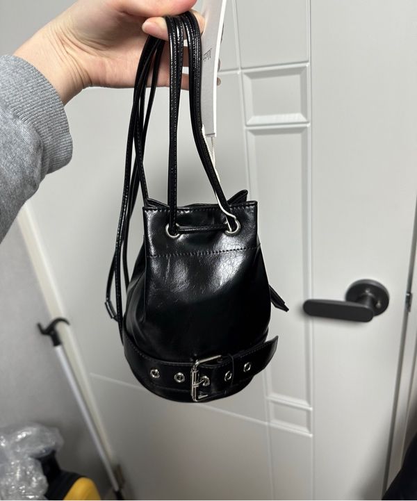 MUSINSA | MATIN KIM BELTED MINI BUCKET BAG IN BLACK
