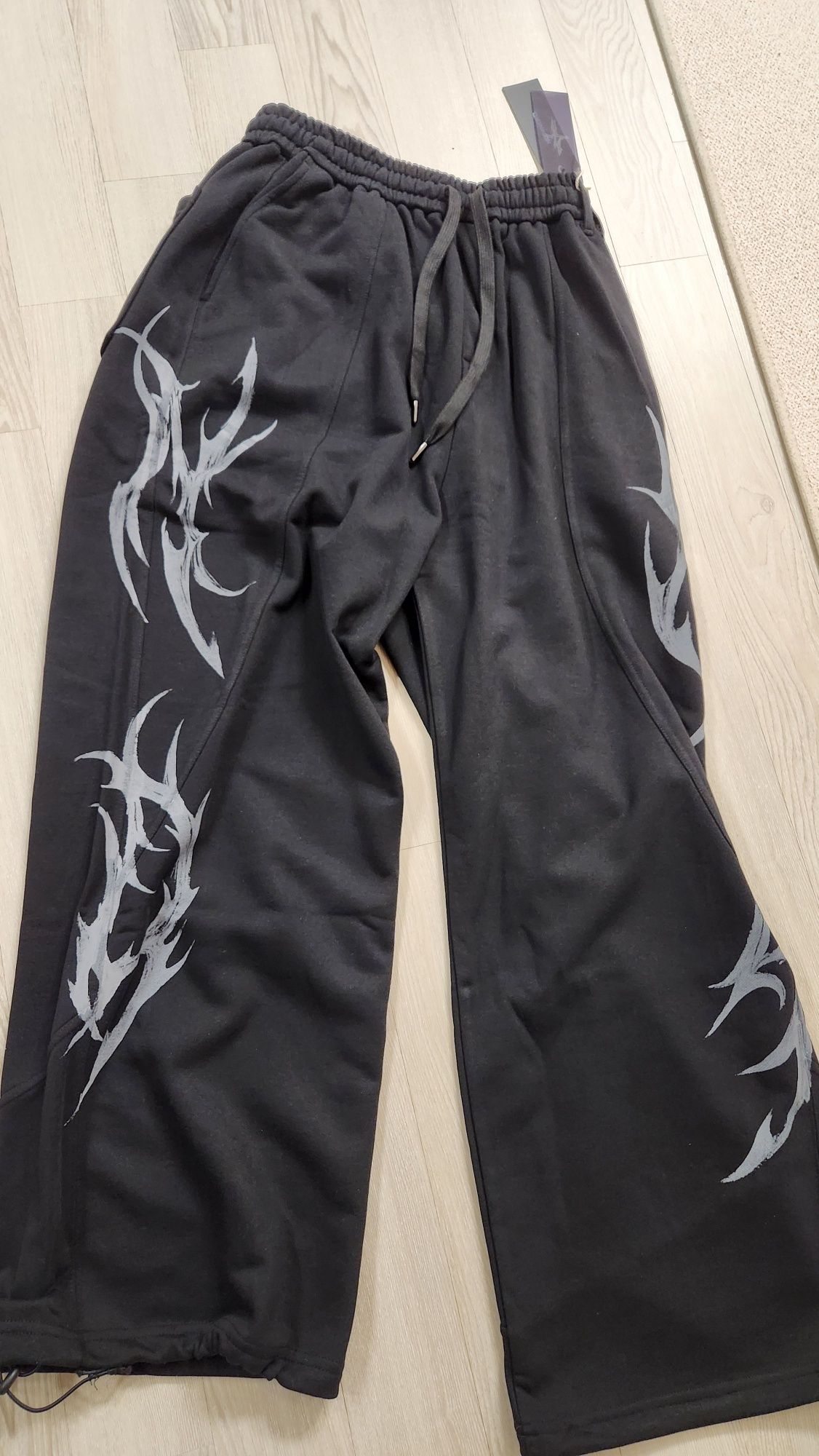 MUSINSA | NOT4NERD Dagger Tribal Logo Incision Sweat Pants
