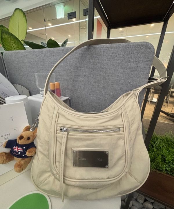 MUSINSA | MATIN KIM NYLON POCKET BAG IN BEIGE