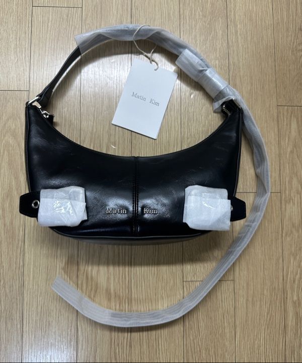 MUSINSA | MATIN KIM BELTED SHOULDER BAG IN BLACK