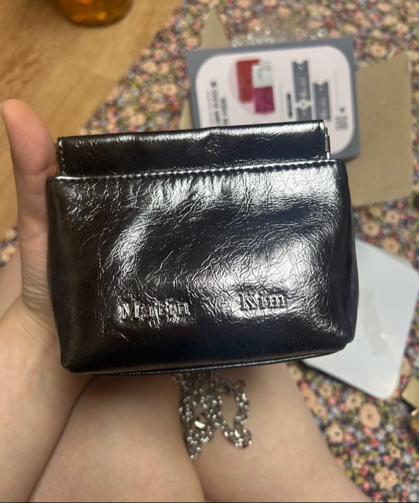 MUSINSA | MATIN KIM GLOSSY LEATHER MINI WALLET BAG IN IVORY