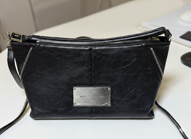 MUSINSA | MATIN KIM SIDE ZIPPER SHOULDER BAG IN BLACK