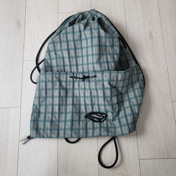 MUSINSA | SUPERSUB SWAVER CHECK STRING BACKPACK - YELLOW