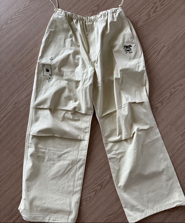 MUSINSA | RONRON DRAWING STITCH PARACHUTE PANTS BEIGE