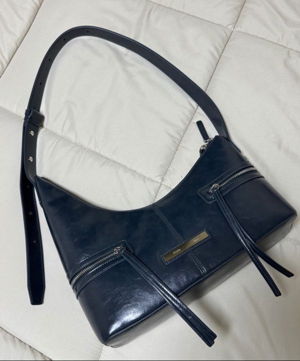MUSINSA | MATIN KIM ASYMMETRICAL ZIPPER BAG IN CHARCOAL