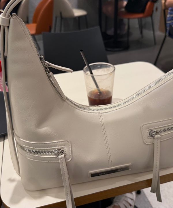 MUSINSA | MATIN KIM ASYMMETRICAL ZIPPER BAG IN IVORY