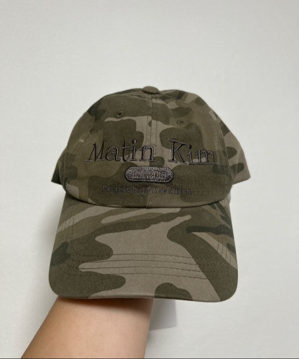 Matin Kim キャップ ブラック ロゴ 迷彩柄 MATINKIM] CAMOUFLAGE LOGO BALL CAP カモフラ ロゴ キャップ