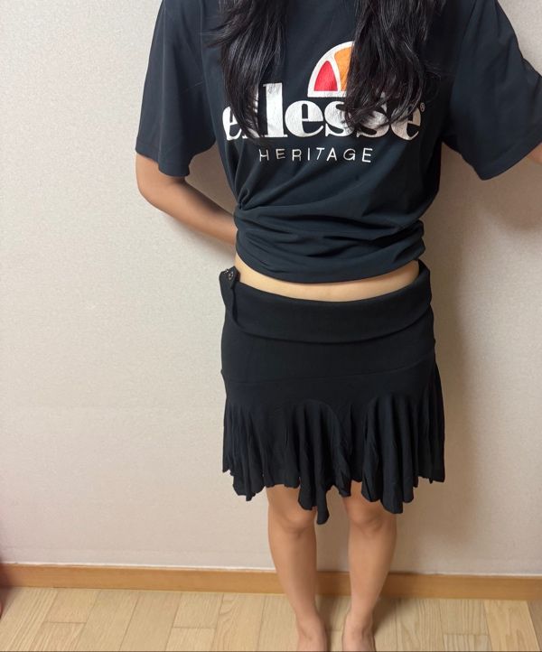 MUSINSA | MATIN KIM UNBALANCE FLARE FOLDING SKIRT IN BLACK