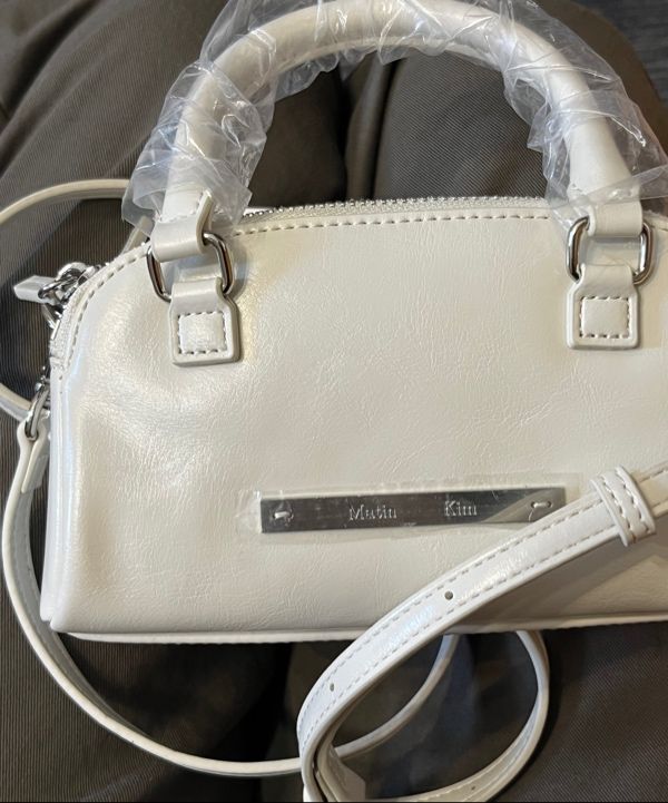 MUSINSA | MATIN KIM DOUBLE ZIPPER MINI CROSS BAG IN BLACK