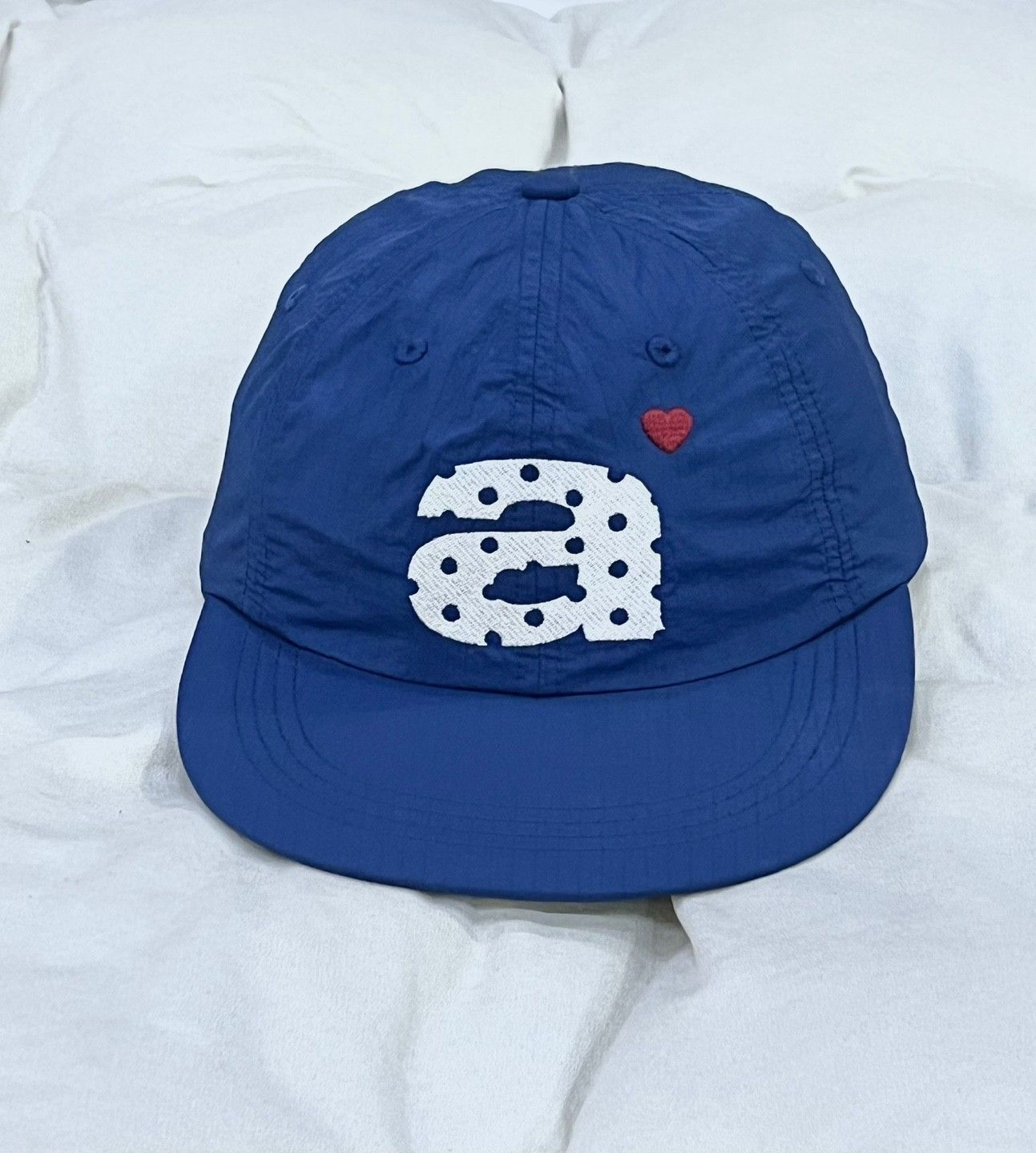 MUSINSA | AEAE DOT SMALL LETTER NYLON CAP [BLUE]