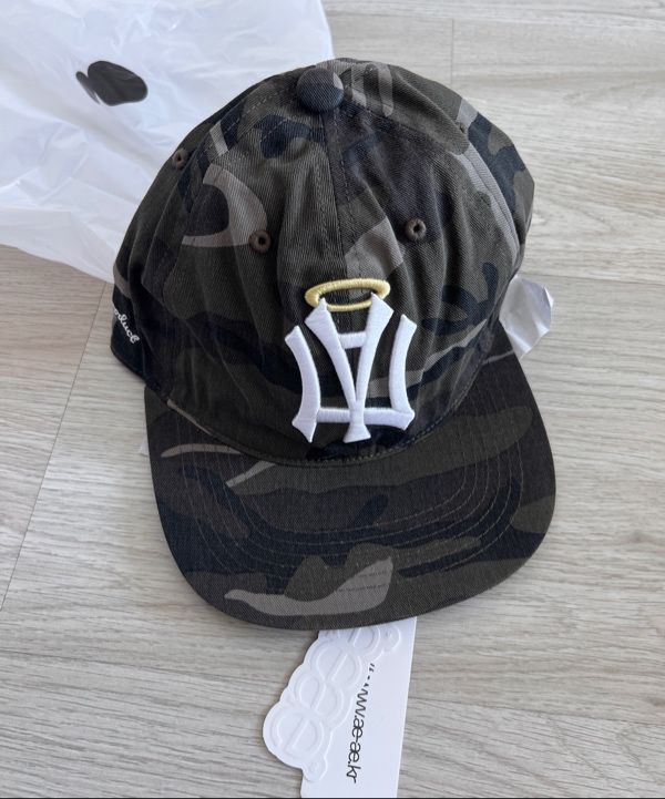 MUSINSA | AEAE AE SYMBOL ANGEL WING CAP [CAMO]