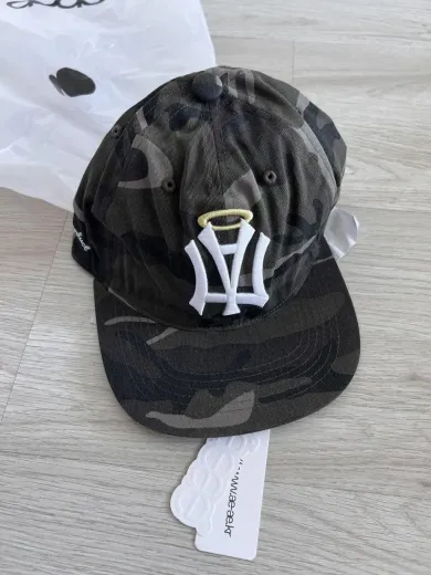 MUSINSA | AEAE AE SYMBOL ANGEL WING CAP [CAMO]
