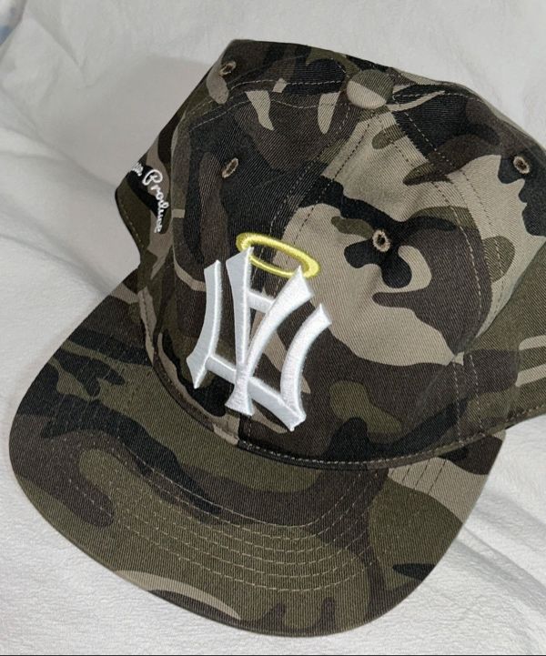 MUSINSA | AEAE AE SYMBOL ANGEL WING CAP [CAMO]