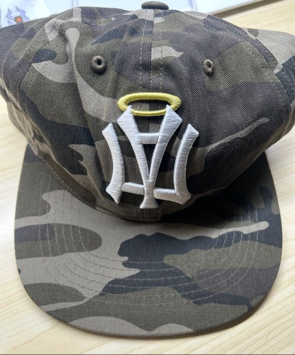 MUSINSA | AEAE AE SYMBOL ANGEL WING CAP [CAMO]