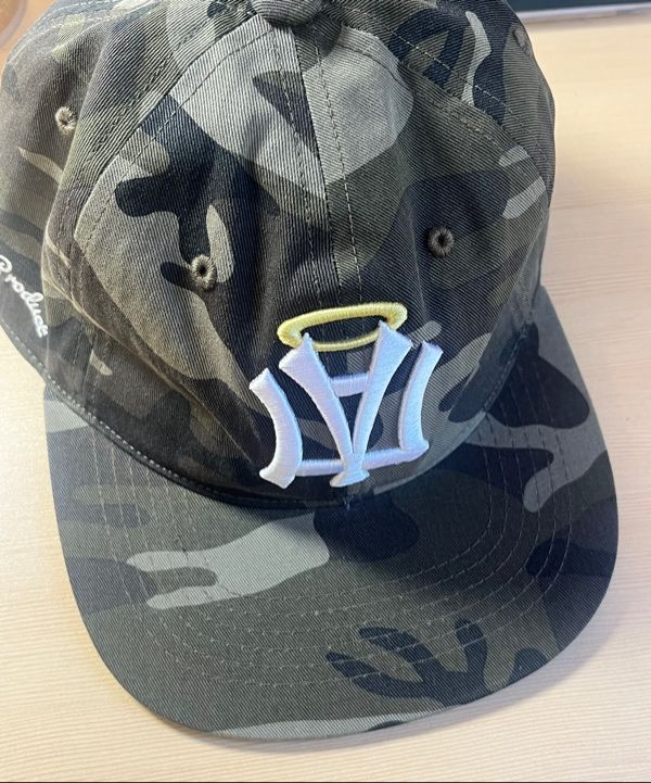 MUSINSA | AEAE AE SYMBOL ANGEL WING CAP [CAMO]