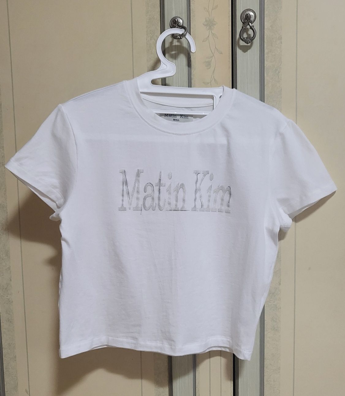 MUSINSA | MATIN KIM PATTERN ARTWORK LOGO CROP TOP IN WHITE