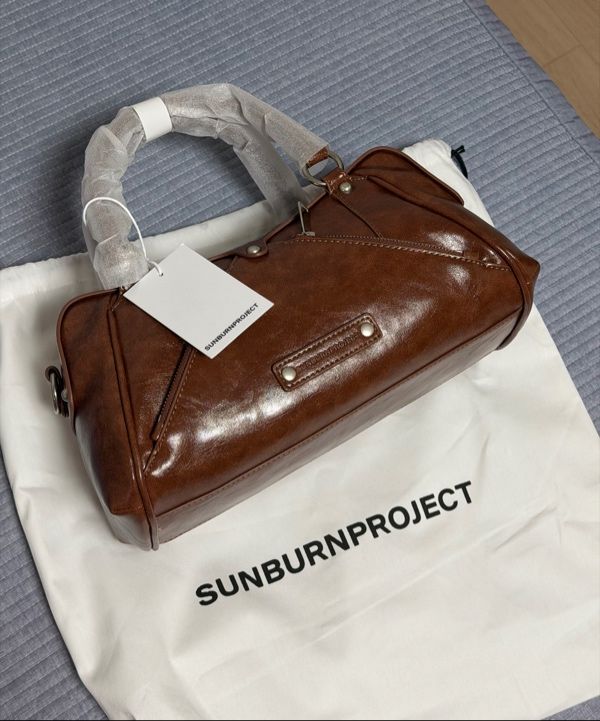 MUSINSA | SUNBURNPROJECT Faux Leather Mini M.O.S Bag, BROWN