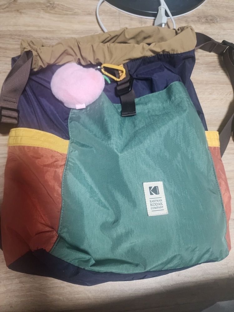 MUSINSA | KODAK Hardy Multicolor String Bucket Backpack KHAKI (20L)