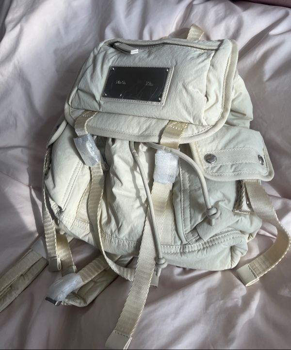 MUSINSA | MATIN KIM POCKET UTILITY SMALL BACK PACK IN LIGHT BEIGE
