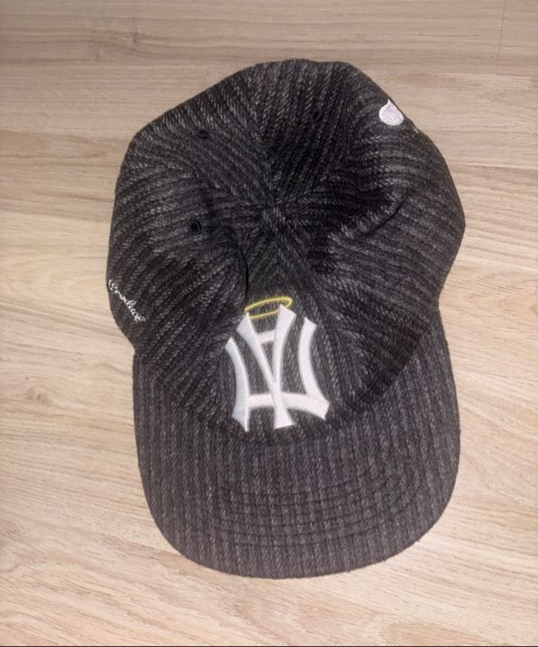 MUSINSA | AEAE AE SYMBOL STRIPE ANGEL WING CAP [BLACK]