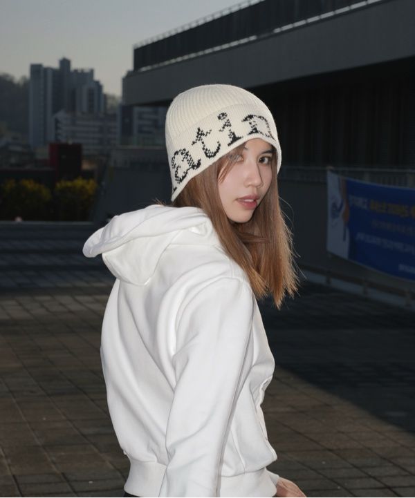 MUSINSA | MATIN KIM CRACKED LOGO BUCKET BEANIE IN IVORY