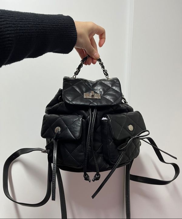 MUSINSA | MATIN KIM DOUBLE POCKET QUILTING MINI BACKPACK IN BLACK