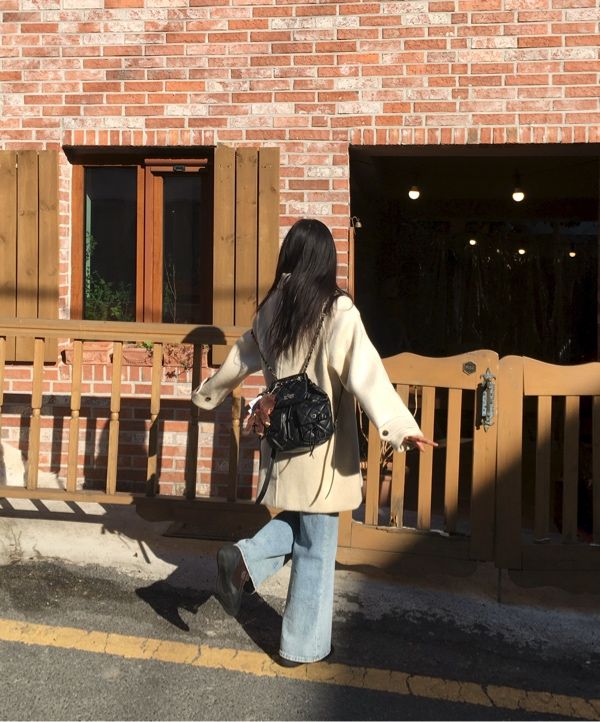 MUSINSA | MATIN KIM DOUBLE POCKET QUILTING MINI BACKPACK IN BLACK