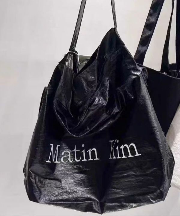 MUSINSA | MATIN KIM GLOSSY LIGHT TWO WAY BAG IN BLACK