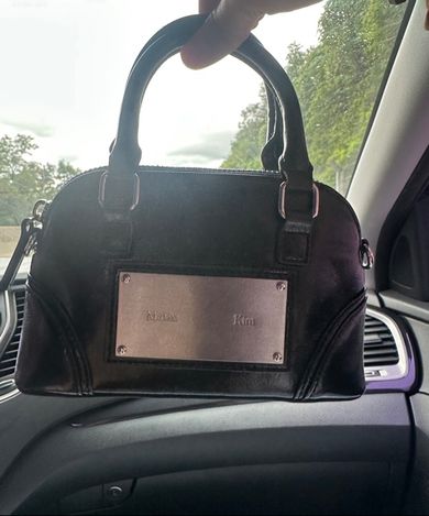 MUSINSA公式 | MATIN KIM CURVE ZIP MINI BAG IN BLACK