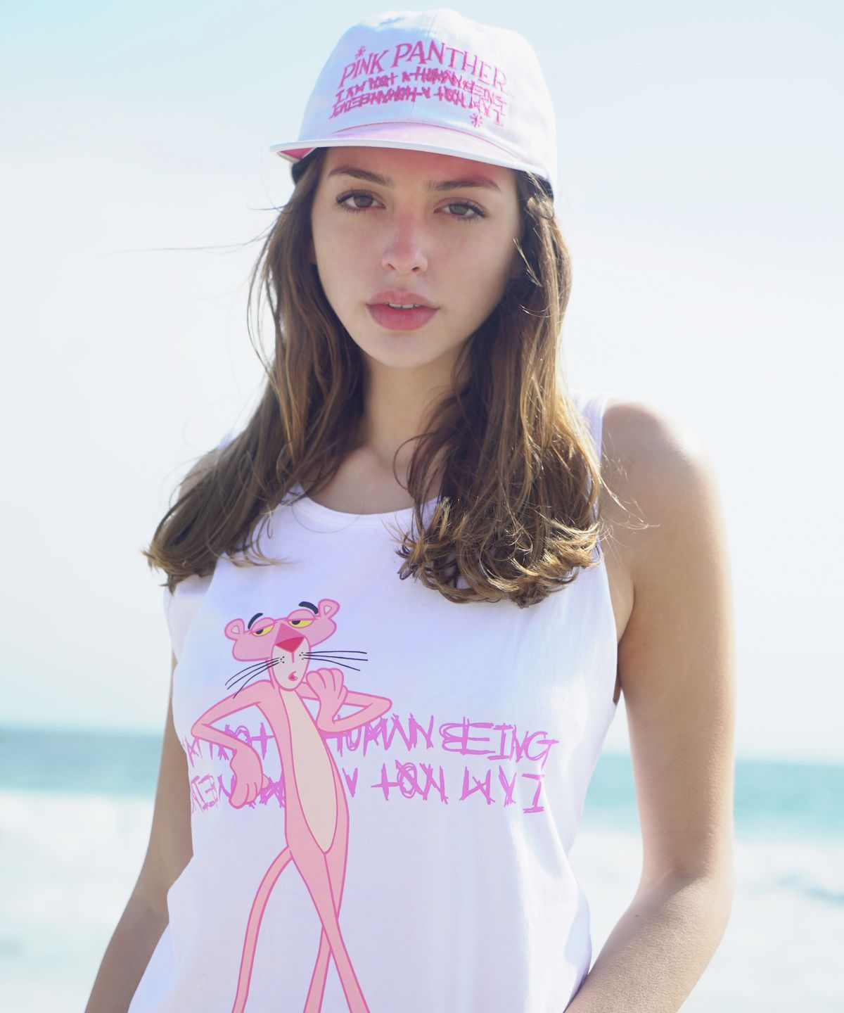 아임낫어휴먼비잉(I AM NOT A HUMAN BEING) HBXPP Pink Panther Leaning Against Our Logo Tank Top - White