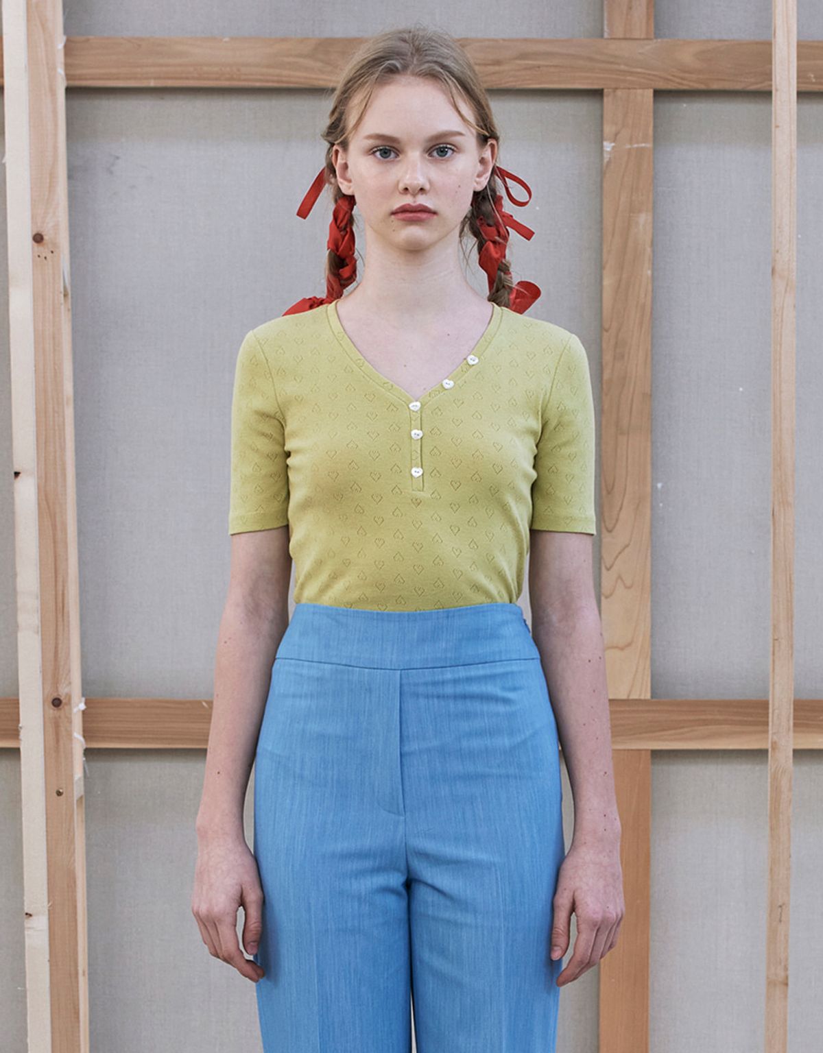 워브먼트(WOVEMENT) Heart Button Point V-neck Top - Light Yellow