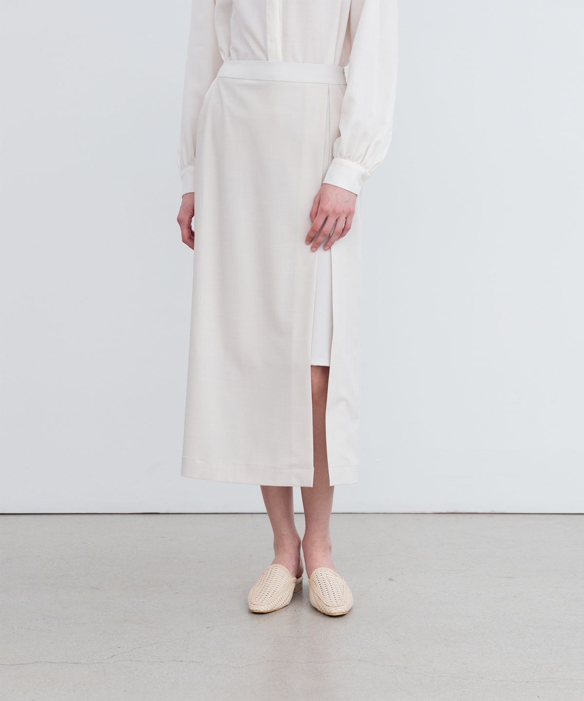 리이(RE RHEE) LAYERED SIDE SLIT MIDI SKIRT