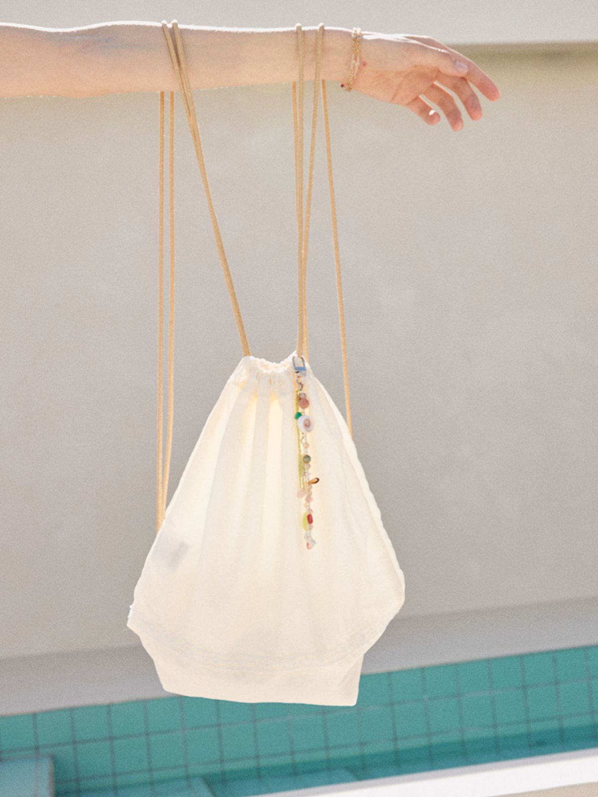 오앨(OUEL) DRAWSTRING BAG_CREAM