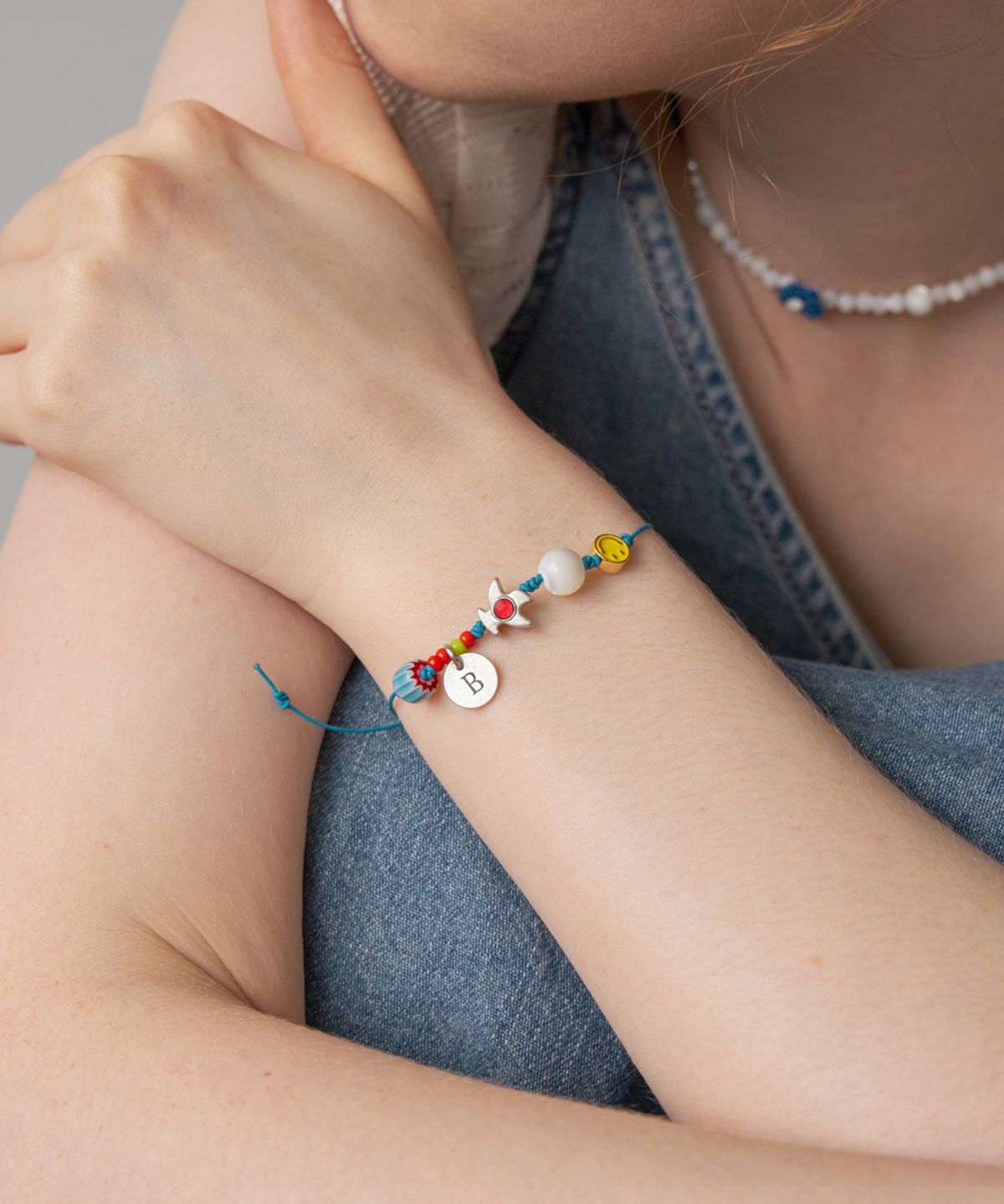메리모티브(MERRYMOTIVE) Free wanderer blue knot bracelet