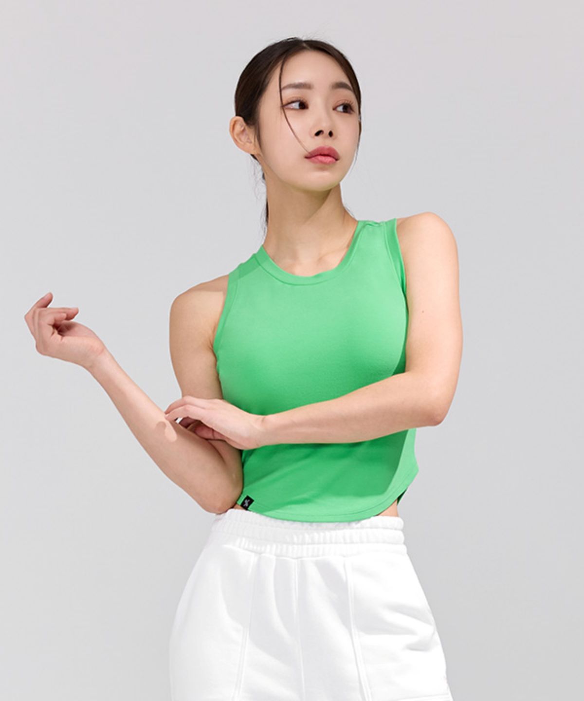 젝시믹스(XEXYMIX) 소프트 텐션 크롭 슬리브리스 브라이트그린