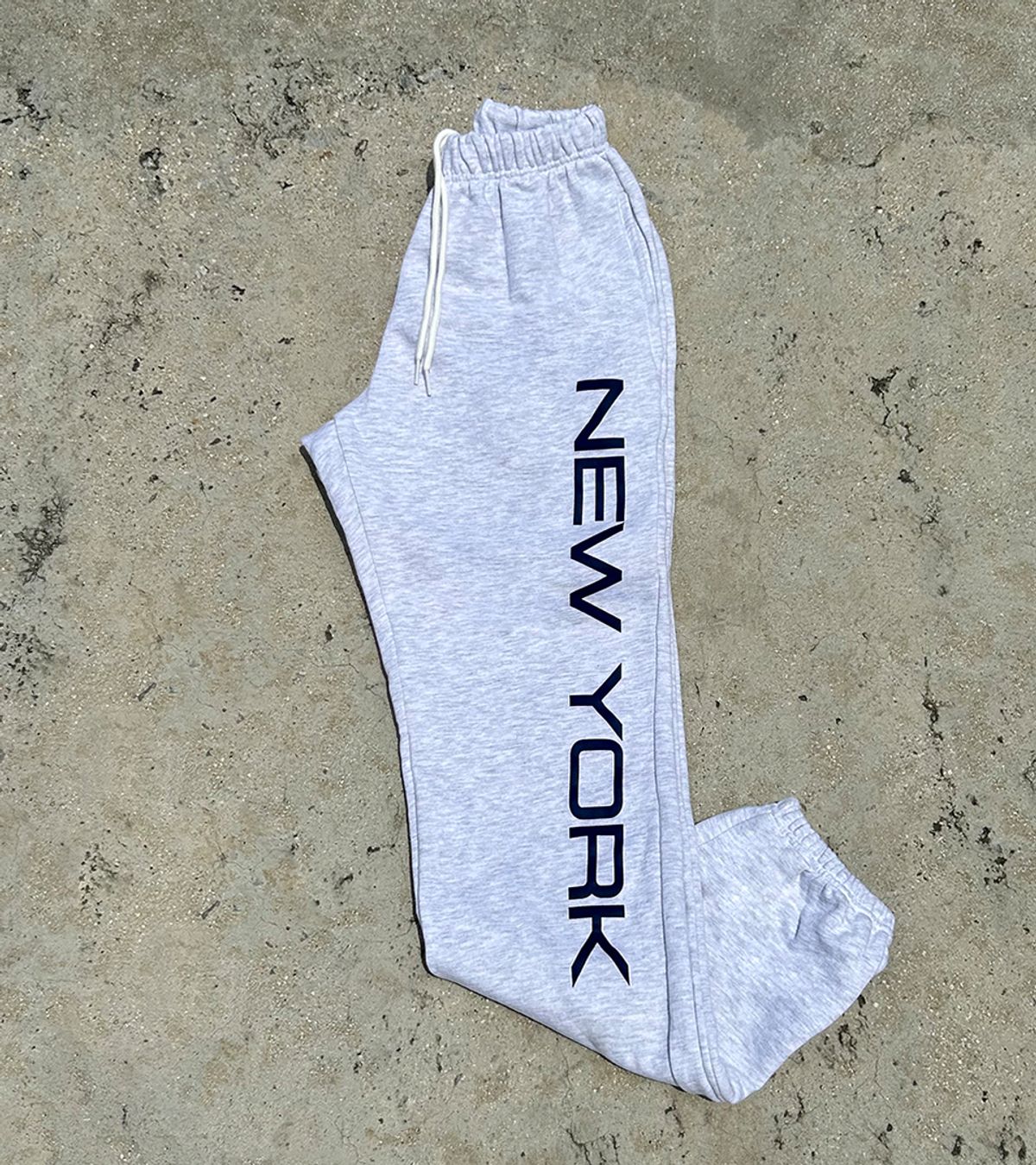 스텝온리(STAFFONLY) NEW YORK SWEATPANTS (MELANGE WHITE)