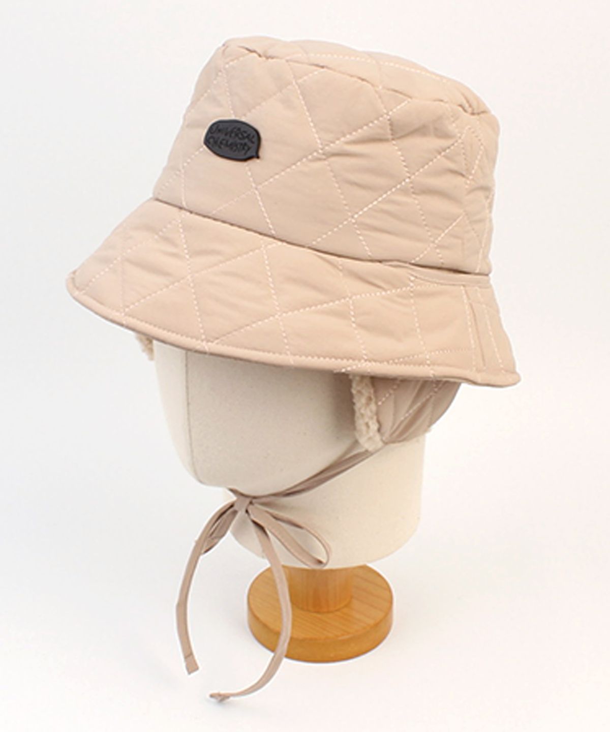 유니버셜 케미스트리(UNIVERSAL CHEMISTRY) Quilting Beige Earflap Bucket Hat 귀달이모자