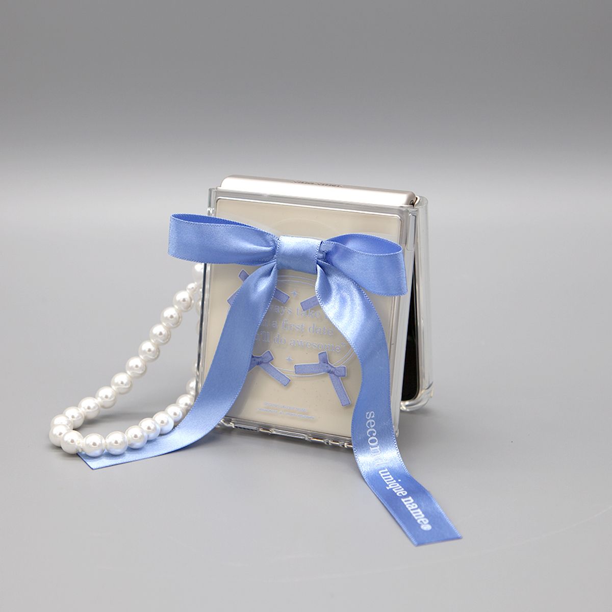 세컨드유니크네임(SECOND UNIQUE NAME) SUN CASE CLEAR BALLET RIBBON BLUE (Z FLIP)