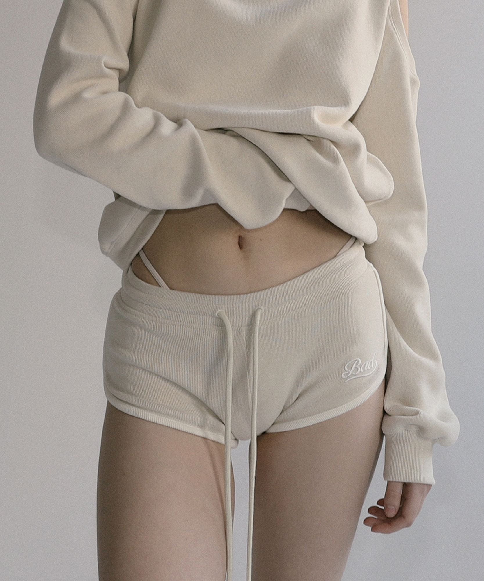 MUSINSA | BADBLOOD Beyond Soft Dolphin Shorts - Cream
