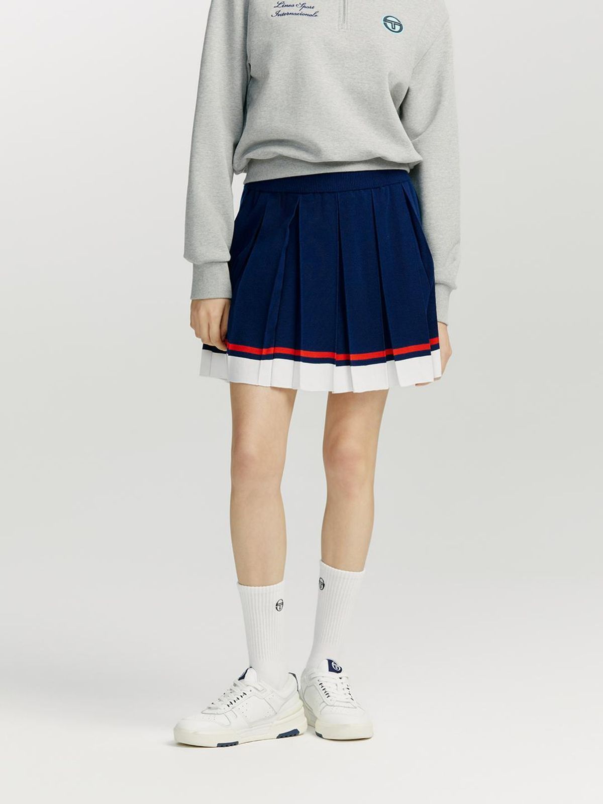 세르지오 타키니(SERGIO TACCHINI) W 프레피 니트 밑단 배색 플리츠 스커트 (Navy)