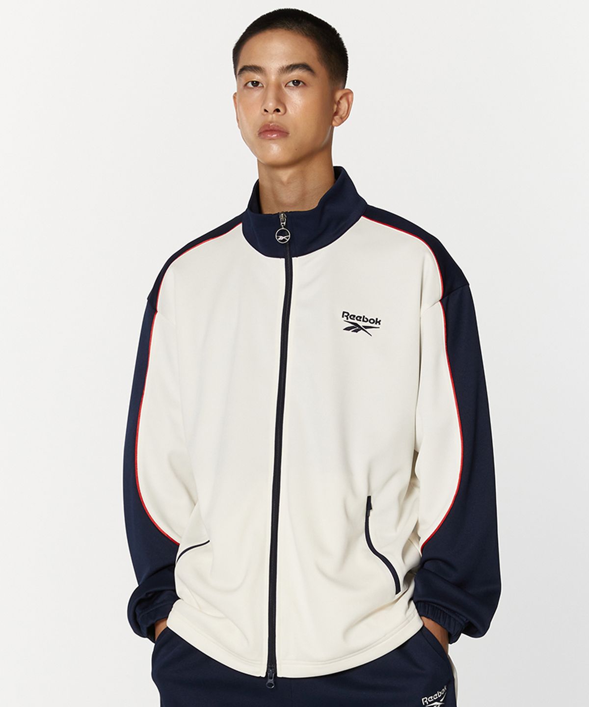 리복(REEBOK) 웜업 트랙탑 - 오프 화이트:네이비