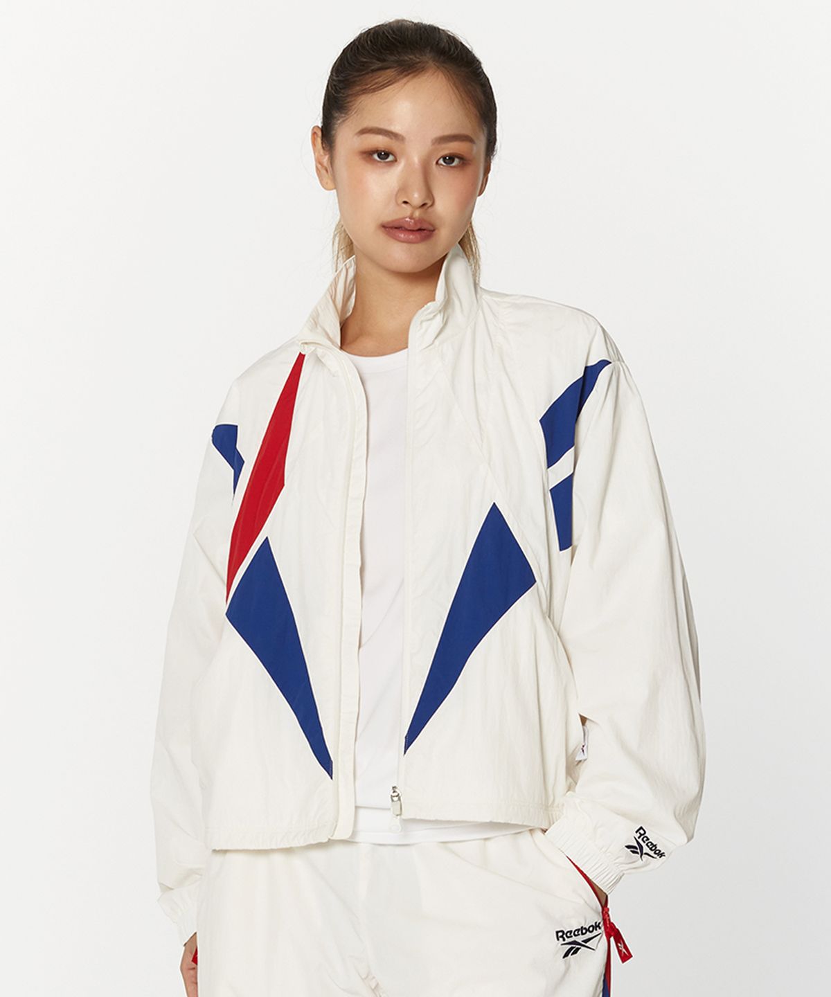 리복(REEBOK) 벡터 플래시 크롭 윈드 브레이커 (W) - 오프 화이트