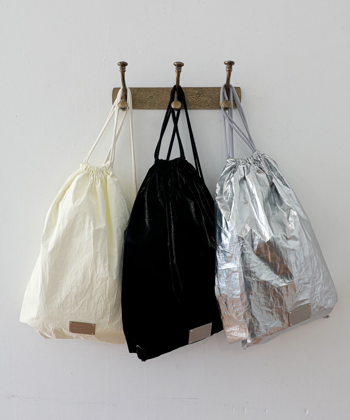 로시로우(LOSSYROW) Metallic String Backpack