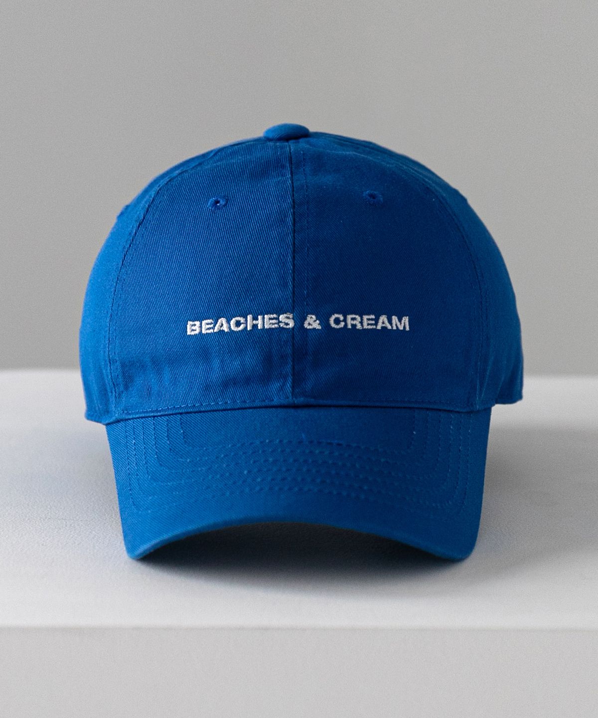 비치스앤크림(BEACHESANDCREAM) SMALL LOGO BALL CAP-BLUE