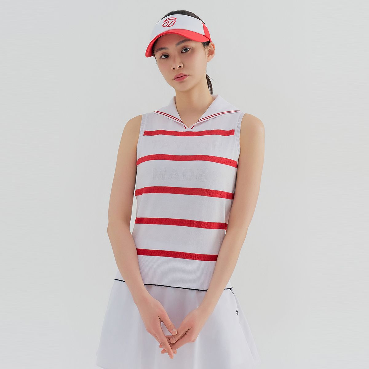 테일러메이드 어패럴(TAYLORMADE APPAREL) 여성 넥변형 슬리브리스 니트 T8031SN6222-500