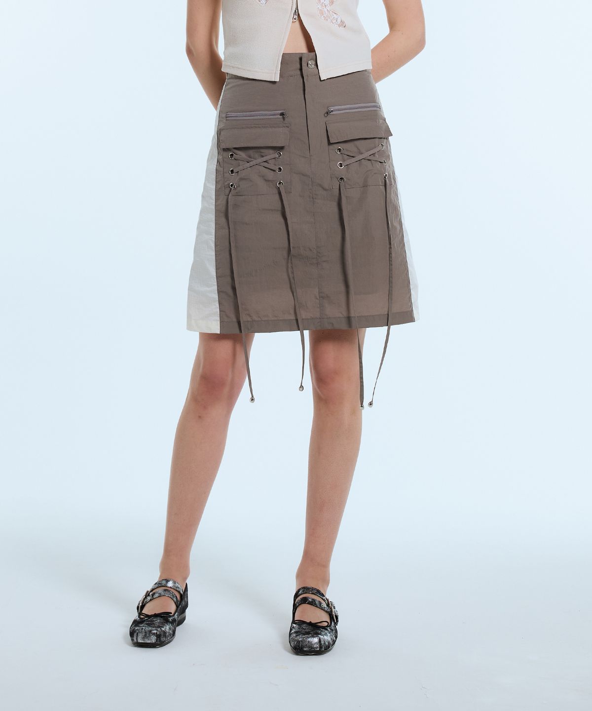 라티젠(LARTIGENT) L11 EYELET NYLON SKIRT(BROWN)