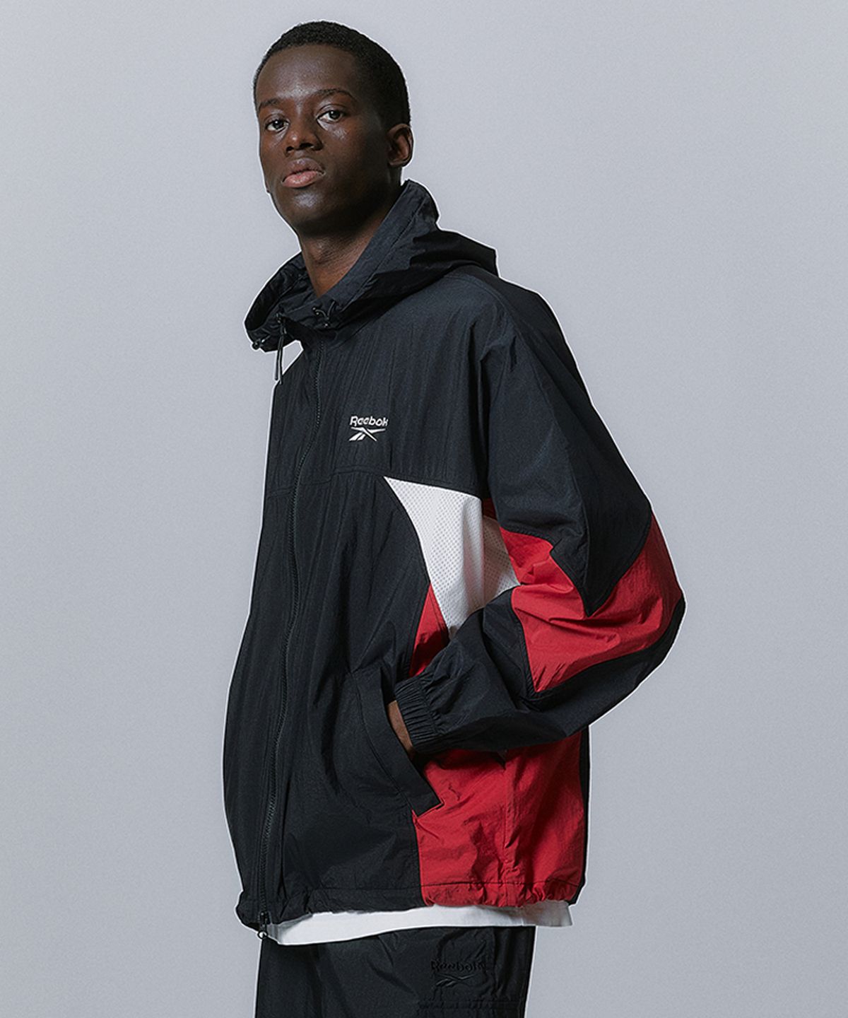 리복(REEBOK) 메쉬 하이브리드 윈드 브레이커 - 블랙