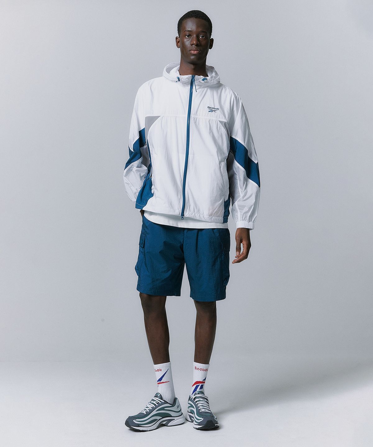 리복(REEBOK) 경량 카고 쇼츠 - 터키쉬 블루