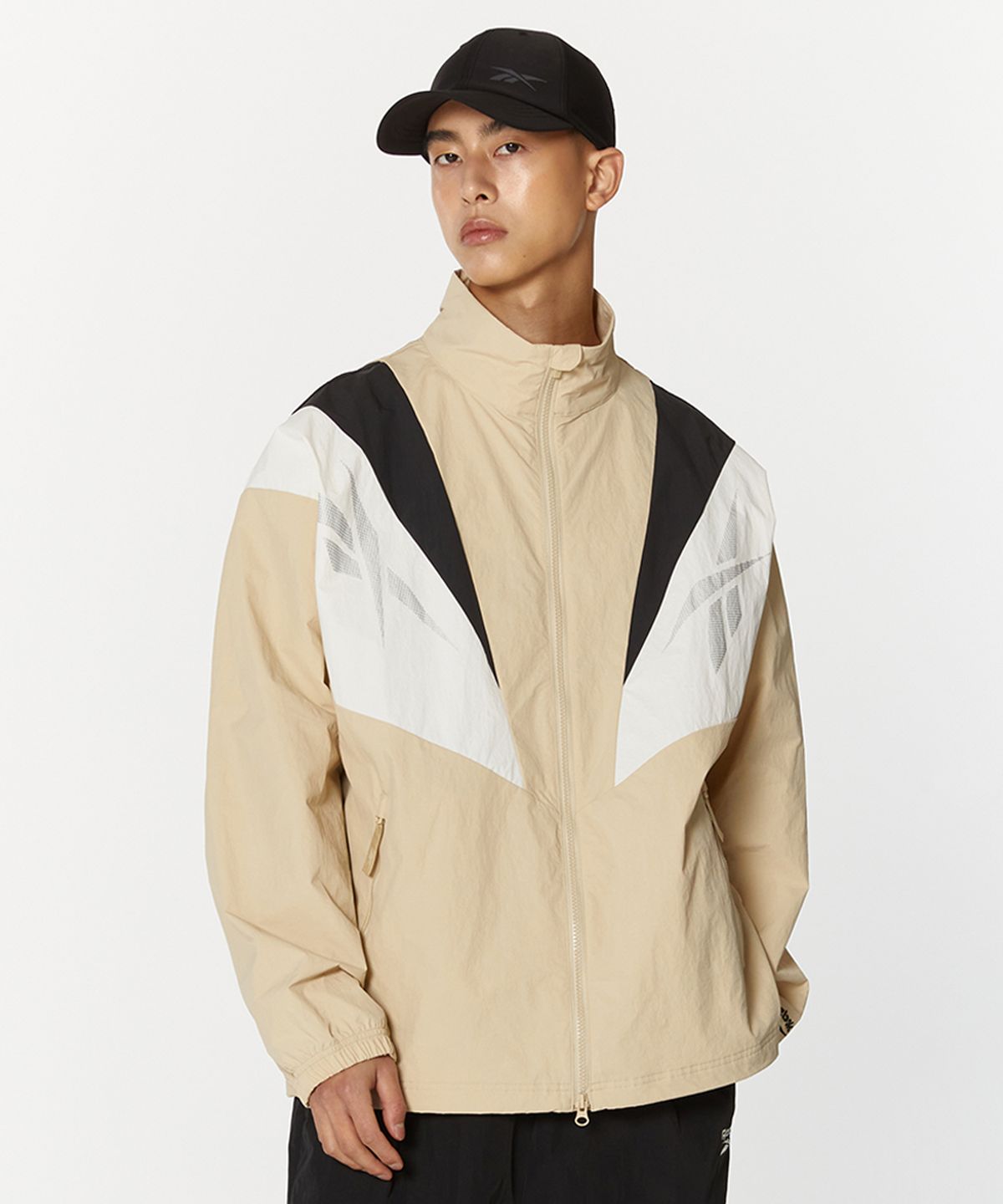 리복(REEBOK) 트윈 벡터 윈드 브레이커 - 베이지