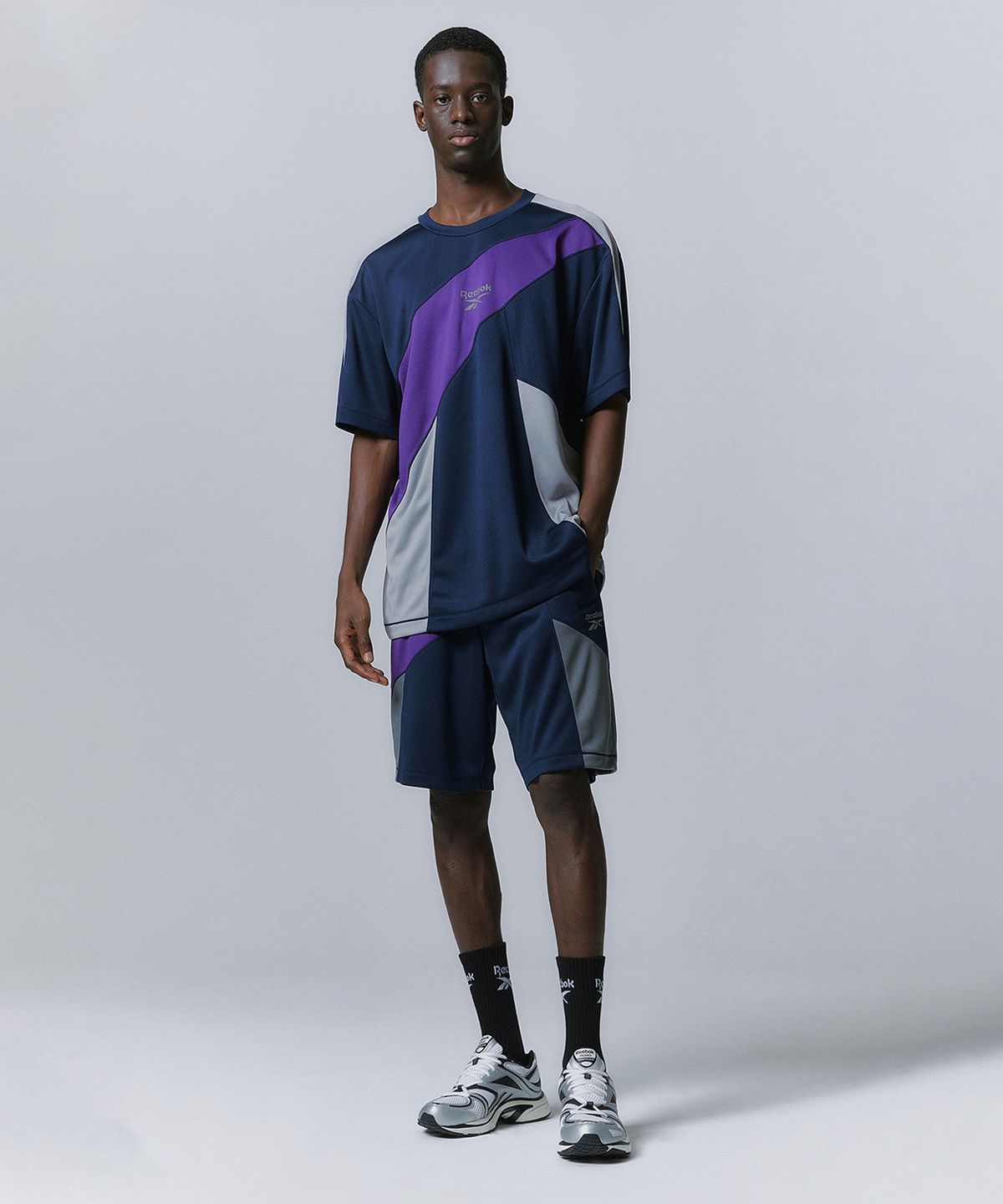 리복(REEBOK) 패널드 벡터 메쉬 쇼츠 - 네이비